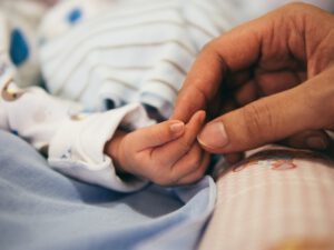 hand holding a child's hand