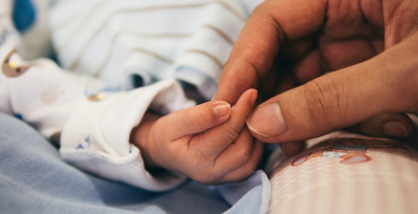 hand holding a child's hand