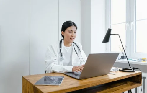 woman sitting at computer desk