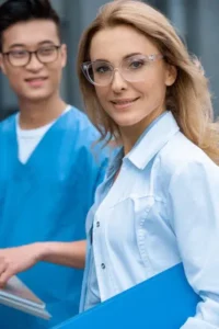 two health workers smiling